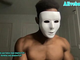 muscle black man in mask shows off his hot body